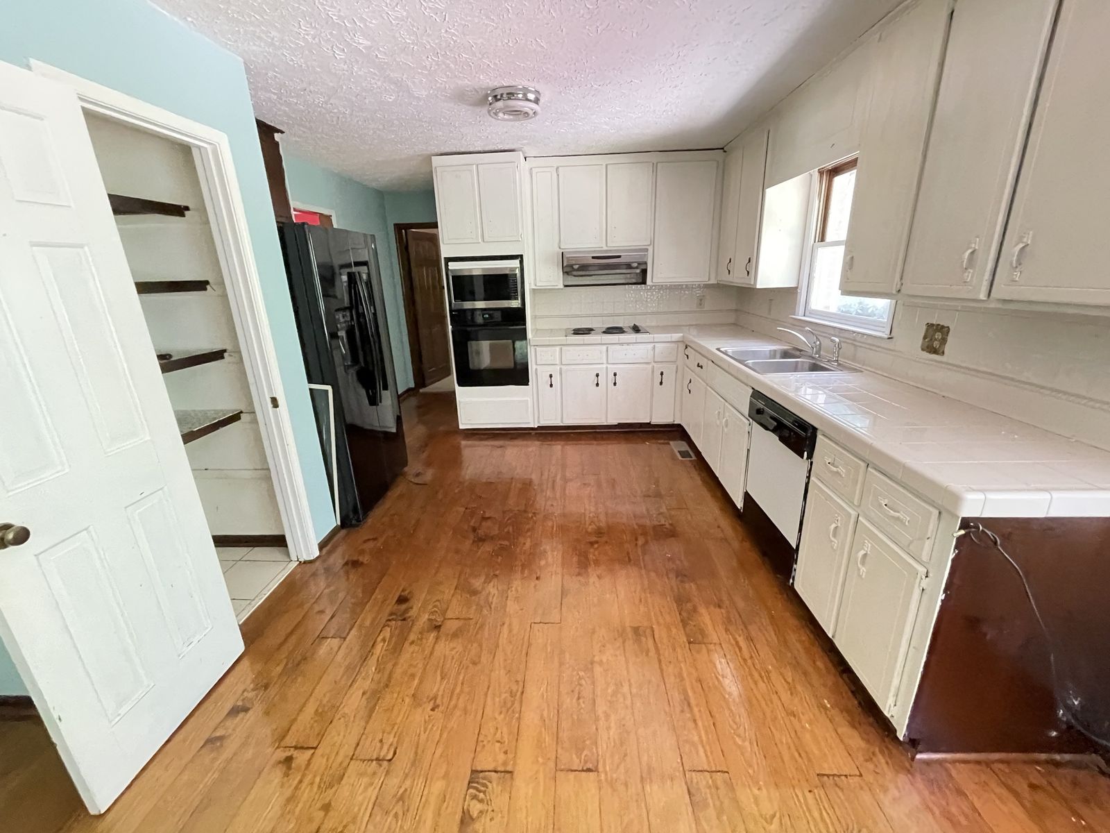 Before: dated kitchen, from one of Wesley&rsquo;s own projects